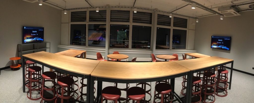 panorama of a large meeting room with video conference setup